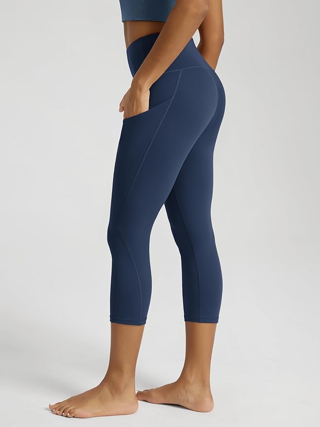 ODODOS Women's High Waisted Yoga Capris with Pockets, Tummy Control Non See Through Workout Athletic Running Capri Leggings