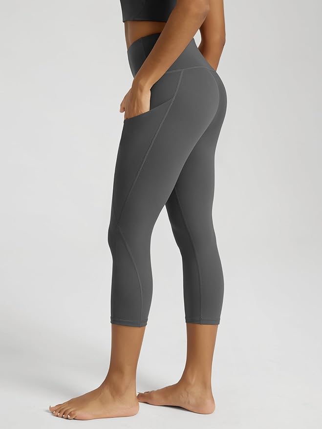 ODODOS Women's High Waisted Yoga Capris with Pockets, Tummy Control Non See Through Workout Athletic Running Capri Leggings