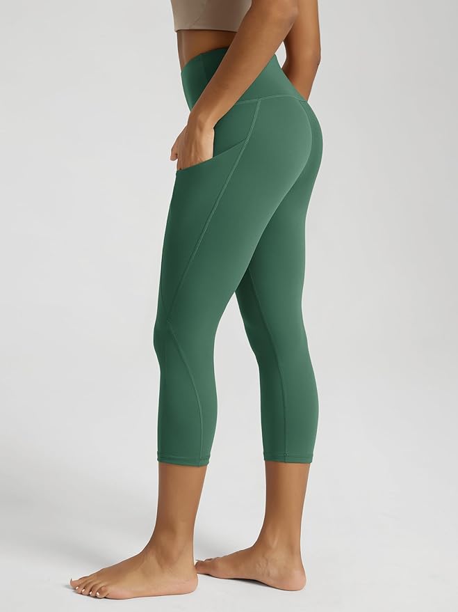 ODODOS Women's High Waisted Yoga Capris with Pockets, Tummy Control Non See Through Workout Athletic Running Capri Leggings