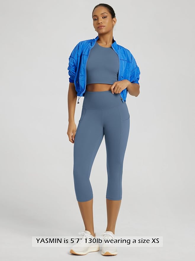 ODODOS Women's High Waisted Yoga Capris with Pockets, Tummy Control Non See Through Workout Athletic Running Capri Leggings