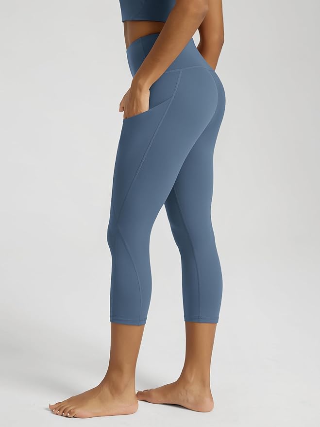 ODODOS Women's High Waisted Yoga Capris with Pockets, Tummy Control Non See Through Workout Athletic Running Capri Leggings