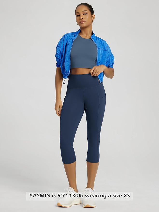 ODODOS Women's High Waisted Yoga Capris with Pockets, Tummy Control Non See Through Workout Athletic Running Capri Leggings