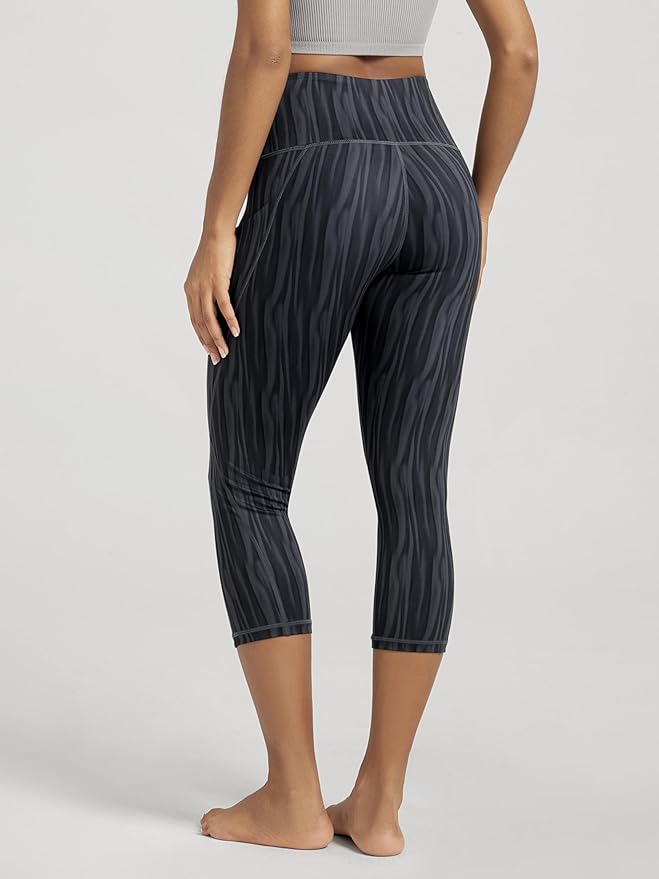 ODODOS Women's High Waisted Yoga Capris with Pockets, Tummy Control Non See Through Workout Athletic Running Capri Leggings