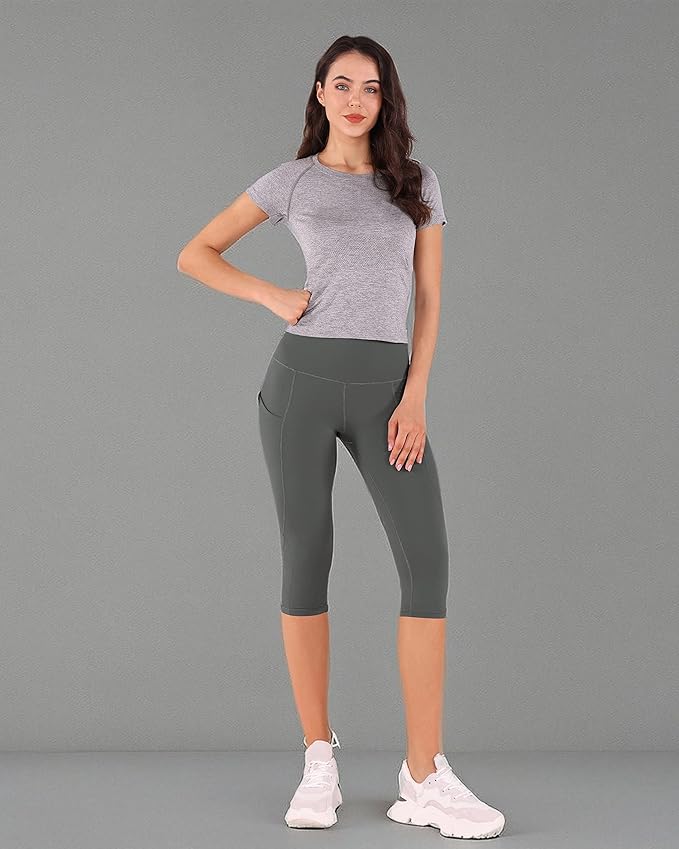 ODODOS Women's High Waisted Yoga Capris with Pockets, Tummy Control Non See Through Workout Athletic Running Capri Leggings